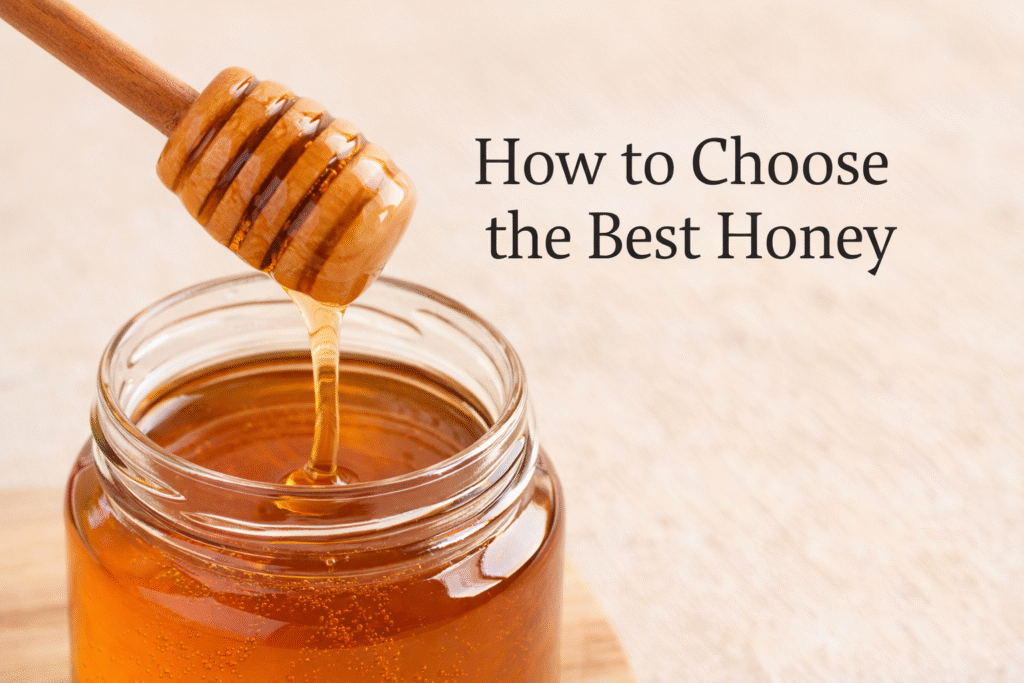 Glass jar of raw honey with a wooden honey dipper showing how to choose the best honey